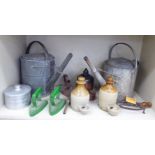 Miscellaneous domestic bygones: to include two similar galvanised iron watering cans;