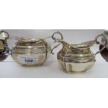 An Edwardian silver twin handled sugar basin and matching cream jug London 1901 CS