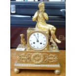 A late 19thC gilt metal clock,