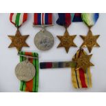 Two British World War II Service Medals on ribbons; The Atlantic Star, The Italy Star,