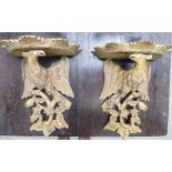 A pair of modern Regency design, gilded composition wall brackets, each fashioned as an eagle,