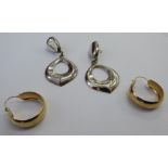 A pair of 9ct gold hoop earrings;