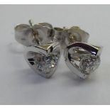 A pair of 18ct white gold, tension set,