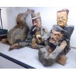 A series of four painted, mixed media caricature busts,