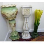 A late Victorian china jardiniere and stand, decorated with flora,