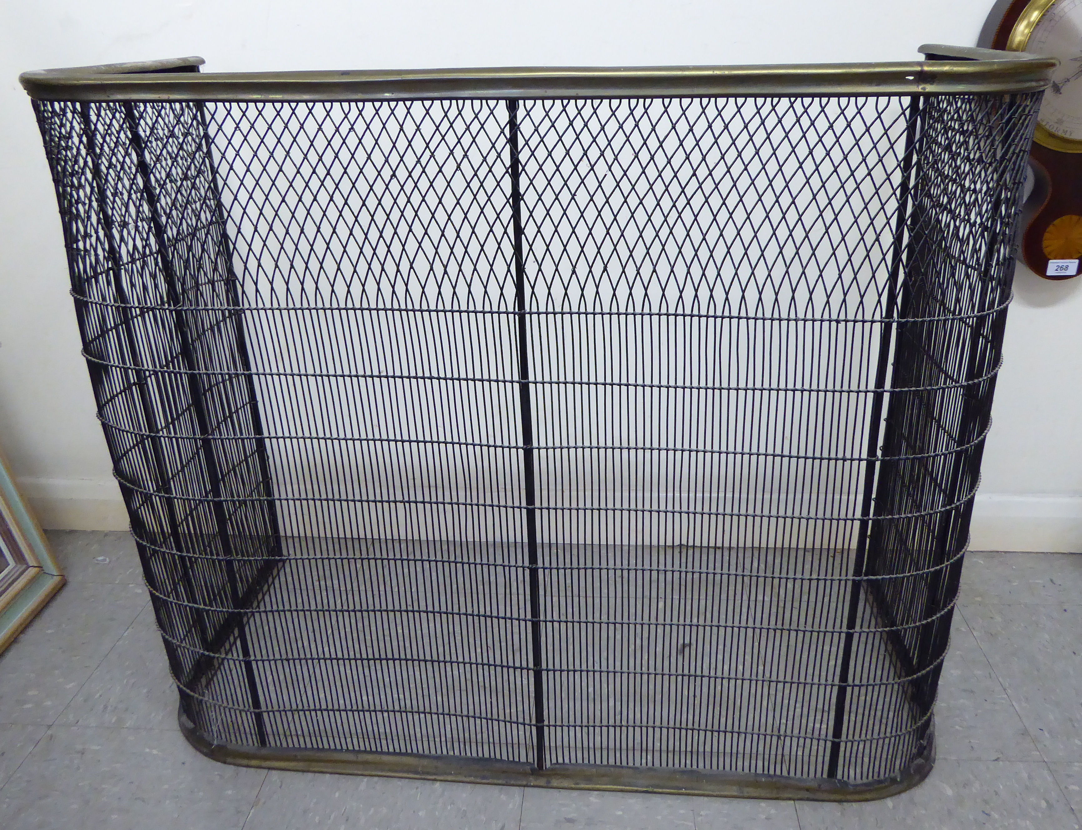 A late Victorian latticed and railed wire nursery fireguard with a brass rim 31''h 37''w S