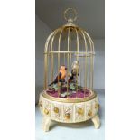 A modern musical lacquered brass caged canary automaton 9.