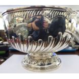 A late Victorian silver pedestal rose bowl with embossed, wrythen moulded,