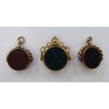 Three similar 9ct gold, bloodstone set, swivel,