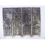 A set of four Chinese silver plated manuscript paperweight,