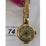 A lady's 18ct gold round cased wristwatch,