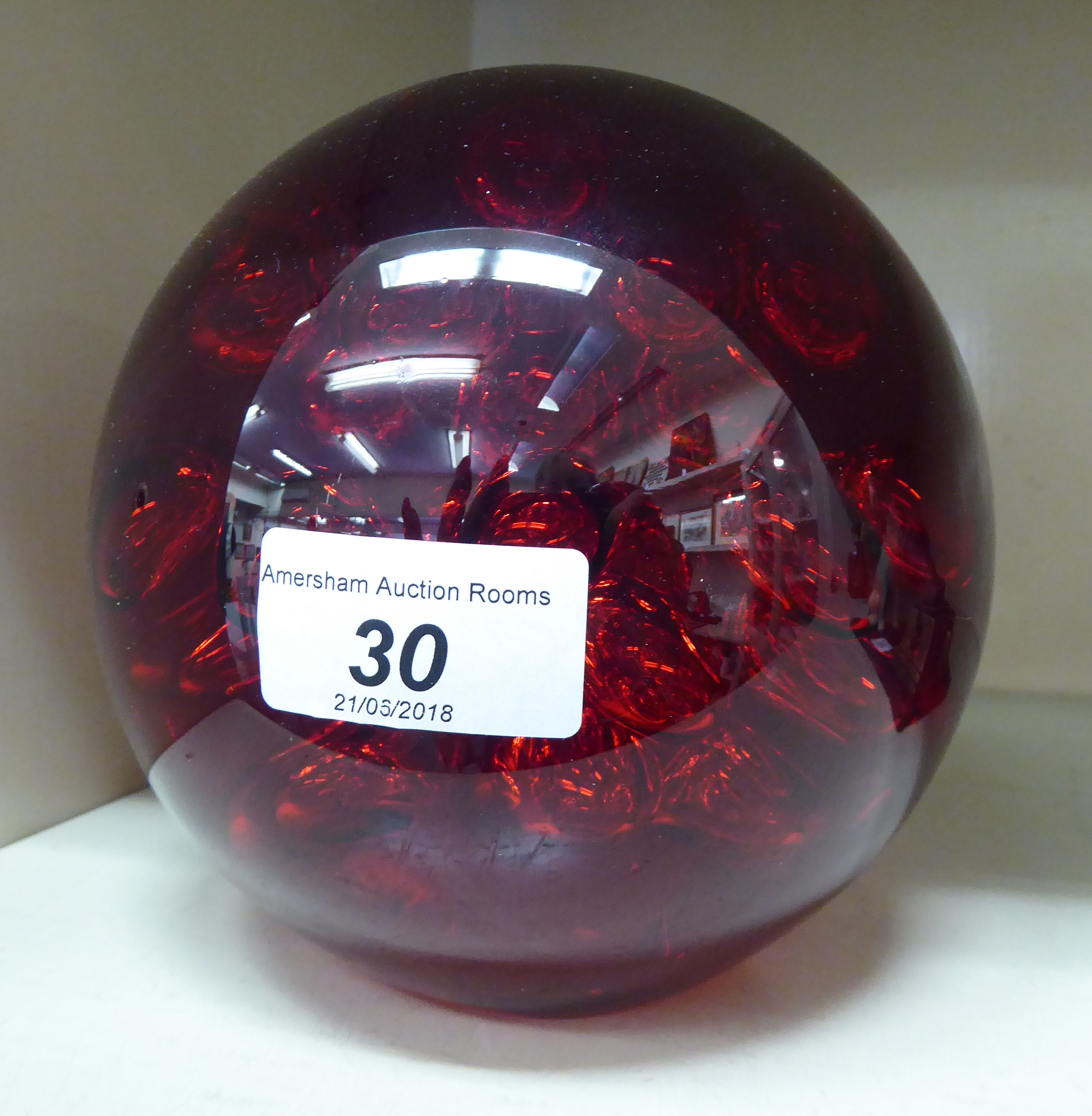 A tinted red glass ball design paperweight 6''h OS10