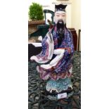 A mid 20thC Chinese porcelain figure, a robed man, on a plinth 14.