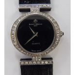 A lady's Baume Mercierdia Ids 18ct white gold wristwatch, encrusted with diamonds,