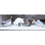 Four Royal Copenhagen porcelain models, viz. a squirrel no.982 2.5''h; a carp no.2414 3.