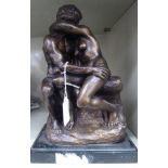 A cast and patinated bronze group, an embracing couple,