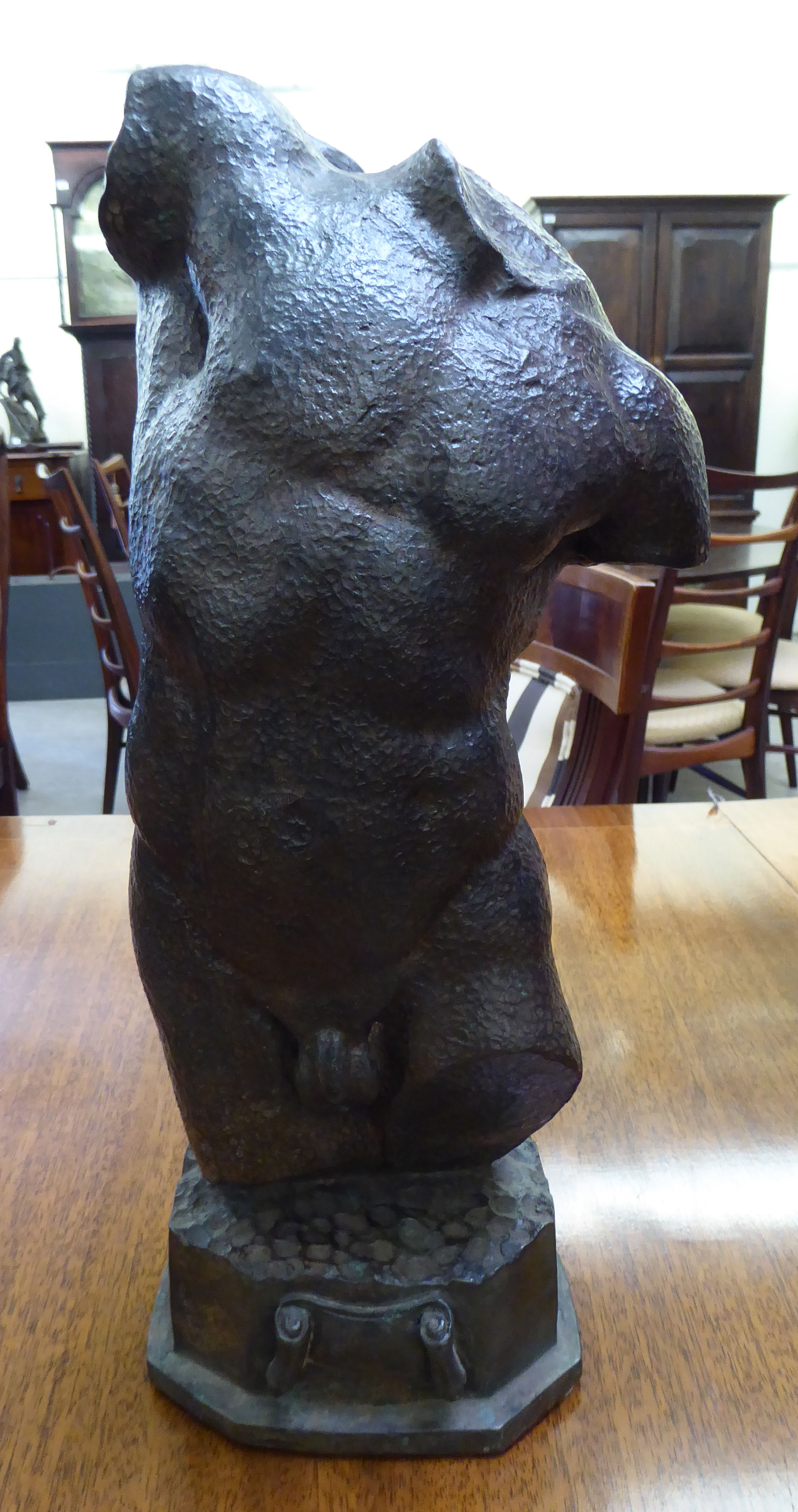 A cast and patinated bronze statue,