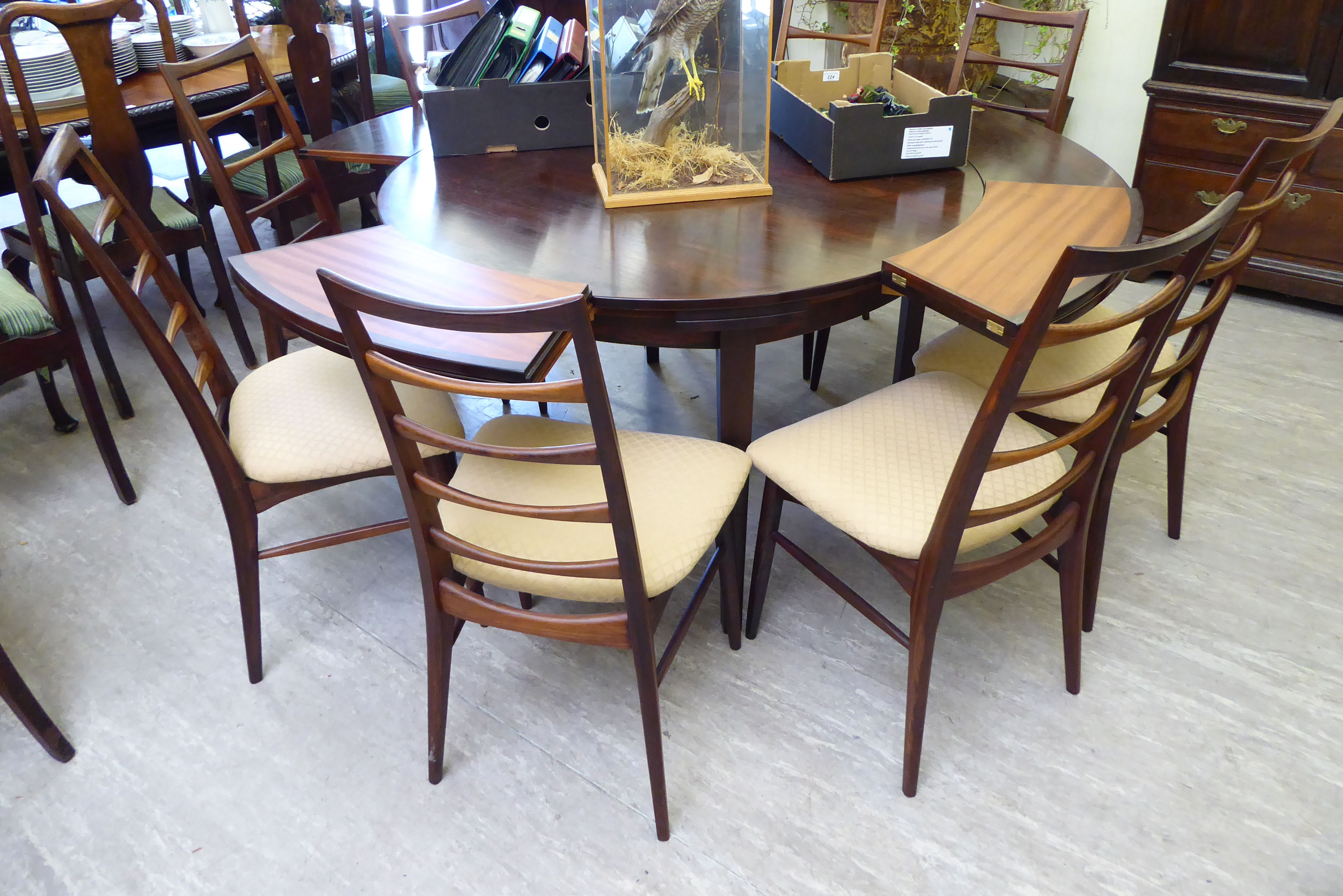 A 1960s Dyrlund rosewood flip-flap (or lotus) expanding dining table, incorporating four hidden, - Image 3 of 3