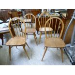 A set of four Ercol beech and elm framed hoop and stick back dining chairs,