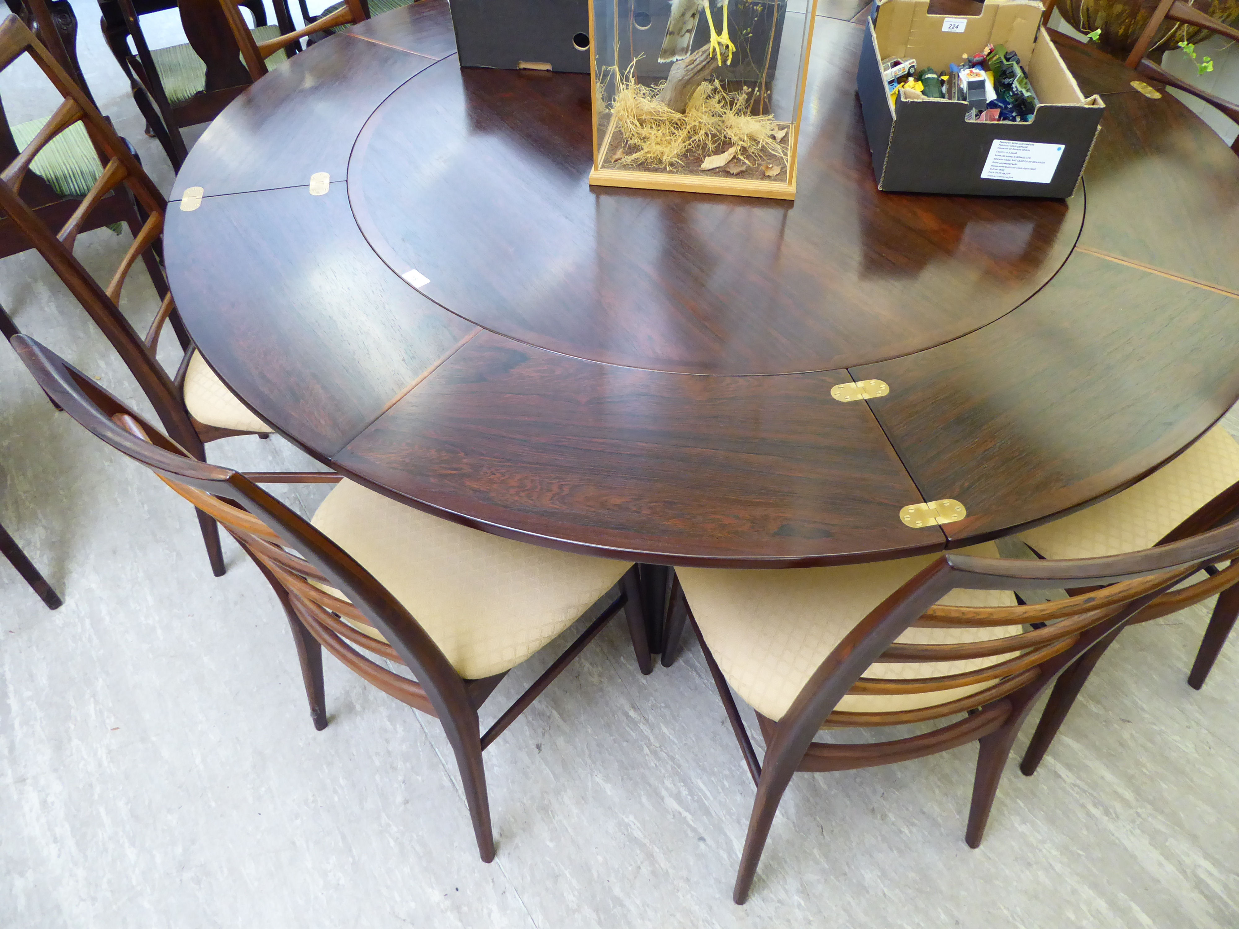 A 1960s Dyrlund rosewood flip-flap (or lotus) expanding dining table, incorporating four hidden, - Image 2 of 3