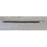 A black painted wooden walking cane,