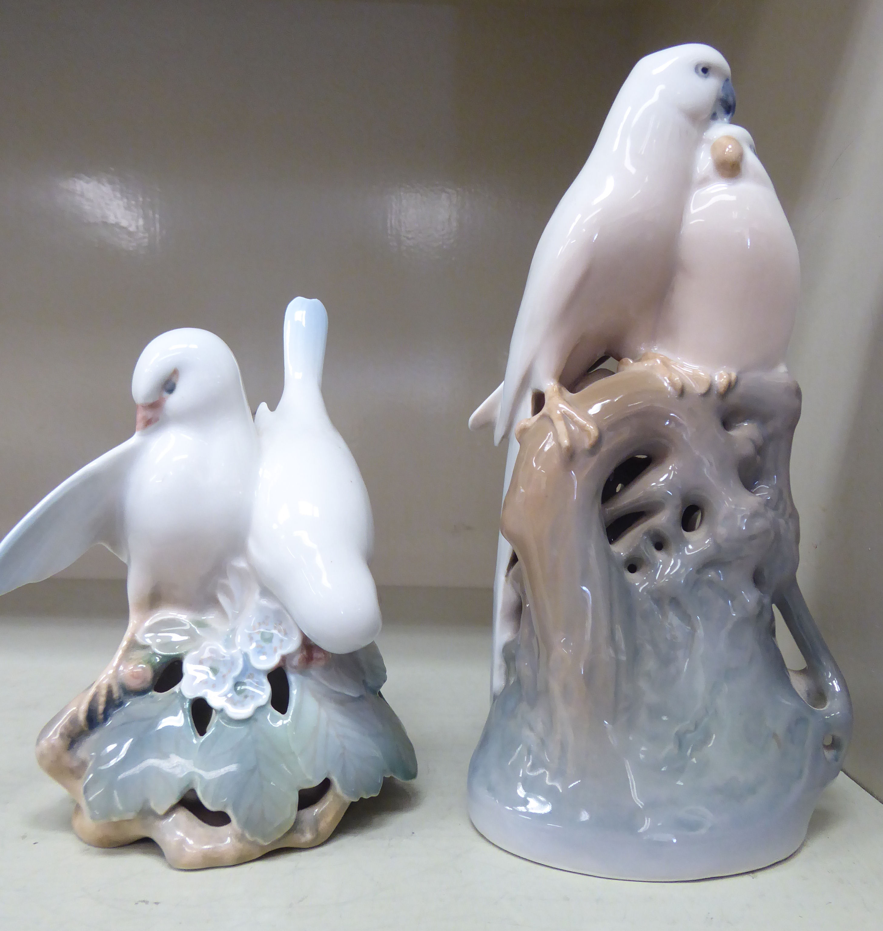 A Royal Copenhagen porcelain model, a pair of parrots no.649 7.