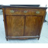 A mid 19thC Dutch flame veneered mahogany sideboard, the top with outset canted corners,