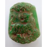 A carved jade pendant,