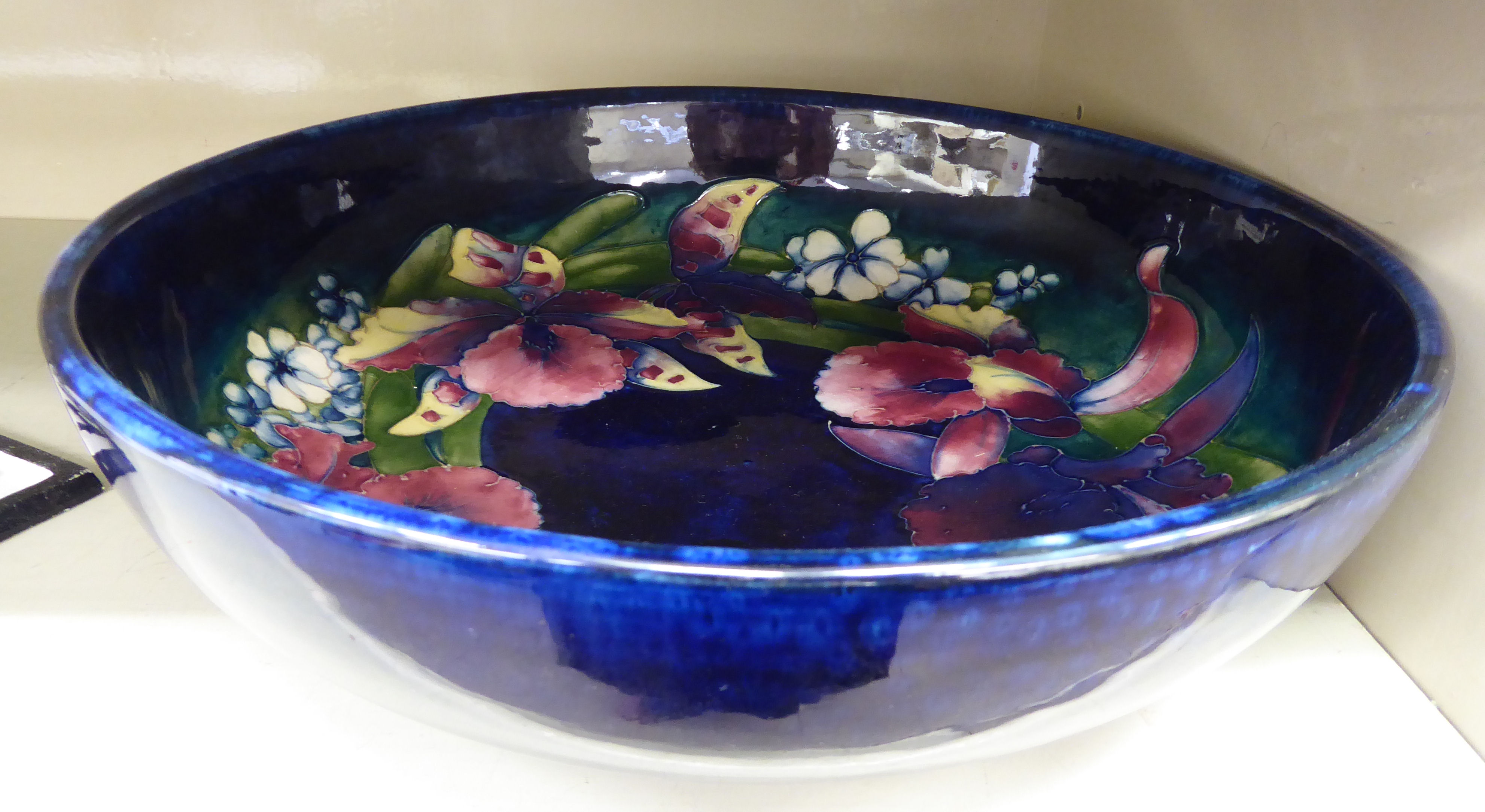 A 1930s Moorcroft pottery shallow fruit bowl bears painted & impressed marks 12.