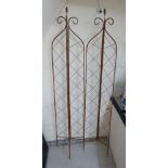 A brown painted metal three-fold garden trellis 68''h BSR