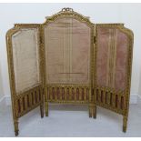 A 19thC Continental carved giltwood framed triptych design firescreen with braided,