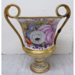 A mid 19thC European porcelain twin handled pedestal vase,