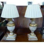 A pair of modern antique effect composition table lamps of baluster form,