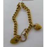 A 9ct gold hollow curb link bracelet with a heart shaped pendant 11
