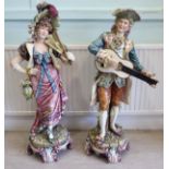 A pair of late 19thC Austrian porcelain standing figures,
