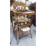 An Edwardian child's stained beech framed metamorphic high chair, raised on square,