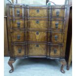 A 1930s Waring & Gillows walnut veneered dressing chest with an inverted breakfront,