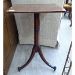 A Regency burr walnut pedestal table, the top over a hexagonal column,