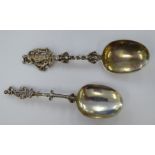 Two 19thC (possibly Dutch) white metal presentation spoons with cast terminals,