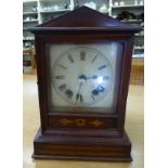An early 20thC Camerer, Kuss & Co mahogany cased mantle clock with an arched top, straight sides,