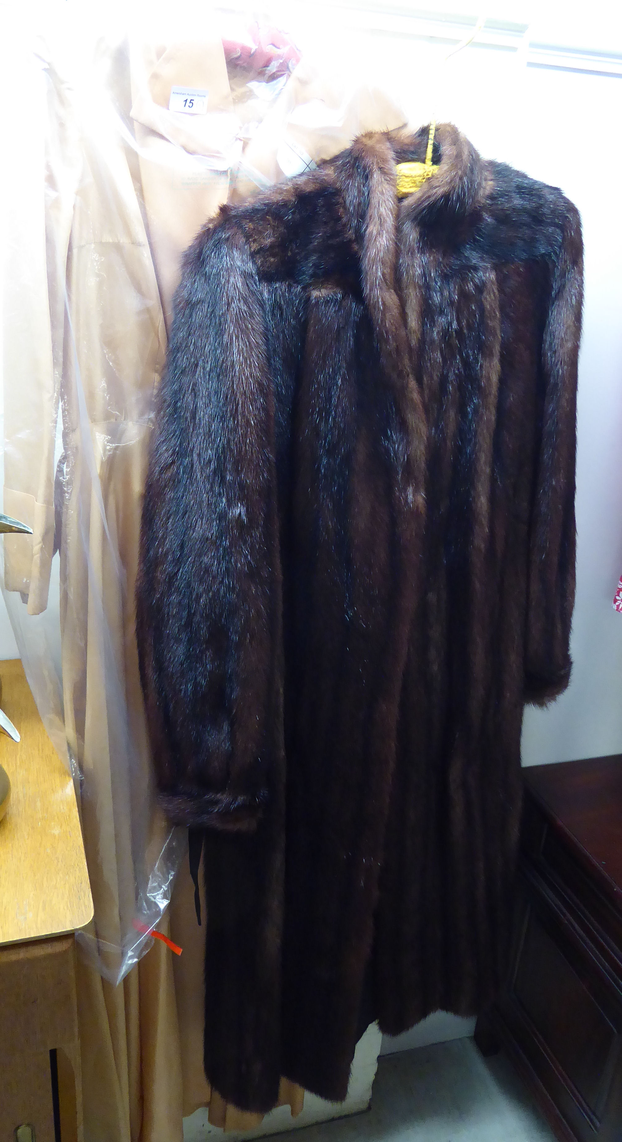 A musquash fur coat with a silk lining;