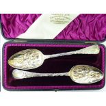 A pair of William IV silver berry spoons London 1831, in a fabric lined,