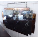 A 1950s unframed mirror with a bevelled clear and bronze coloured slips,