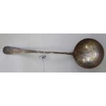 An Edwardian silver Hanoverian rattail pattern soup ladle with a round bowl and an engraved