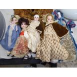Five early 20thC bisque and porcelain head dolls: to include an Armand Marseille example stamped