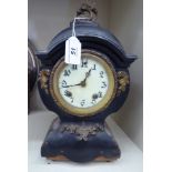 A late 19thC French black enamelled steel balloon cased and gilt metal mounted mantle clock;