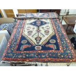 Three similar Persian rugs, each with stylised designs on multi-coloured grounds 53'' x 76'',