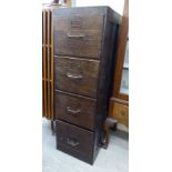 A 1930s stained oak four drawer filing cabinet, on a plinth 53.