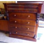 A late Victorian mahogany five drawer dressing chest with bun handles,