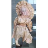 An early 20thC Max Handwergk bisque head doll with weighted sleeping eyes,